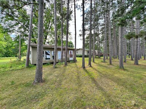 Bunkhouse with cabin in the background at lakeside location.jpg