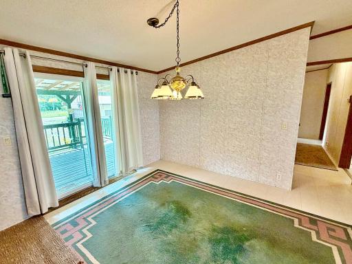 Dining area with sliding door leading to deck.jpg