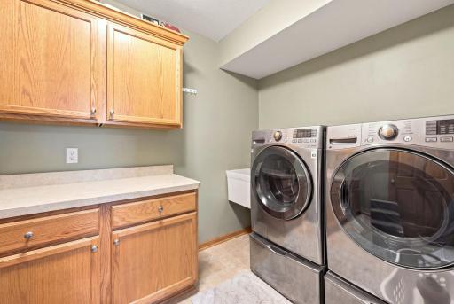 Lower level laundry room featuring ample space for everyday laundry needs