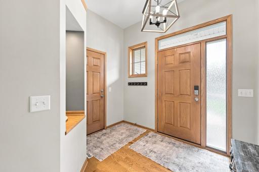 Welcoming entryway featuring convenient garage door access and functionality