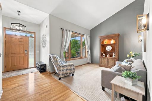 Spacious sitting area featuring vaulted ceilings