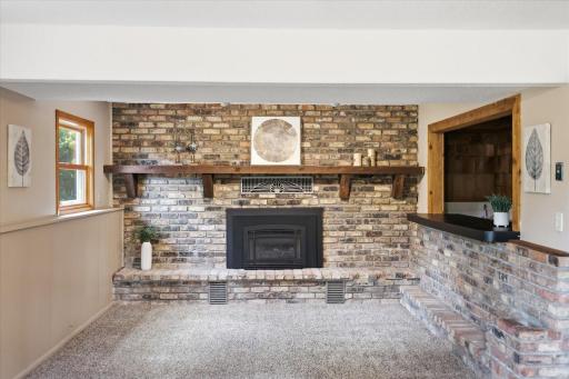 Gas burning fireplace in lower level