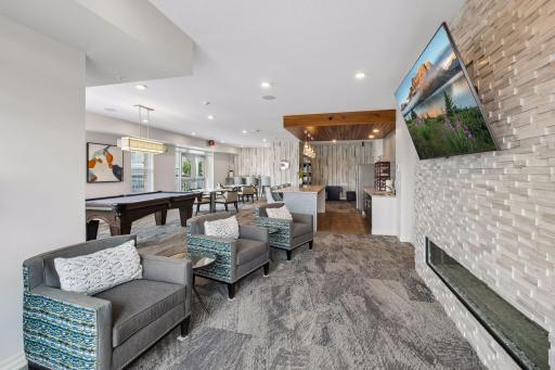 With a double sided fireplace and TV, this shared gathering space would be a great place to catch a movie, too!