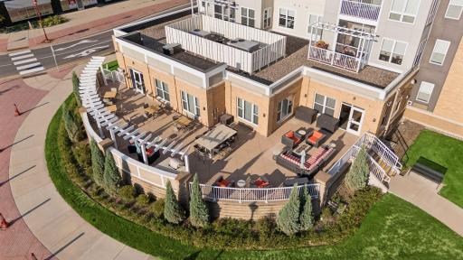 Outdoor terrace offering a grill, fire table & plenty of seating for all owners to enjoy.