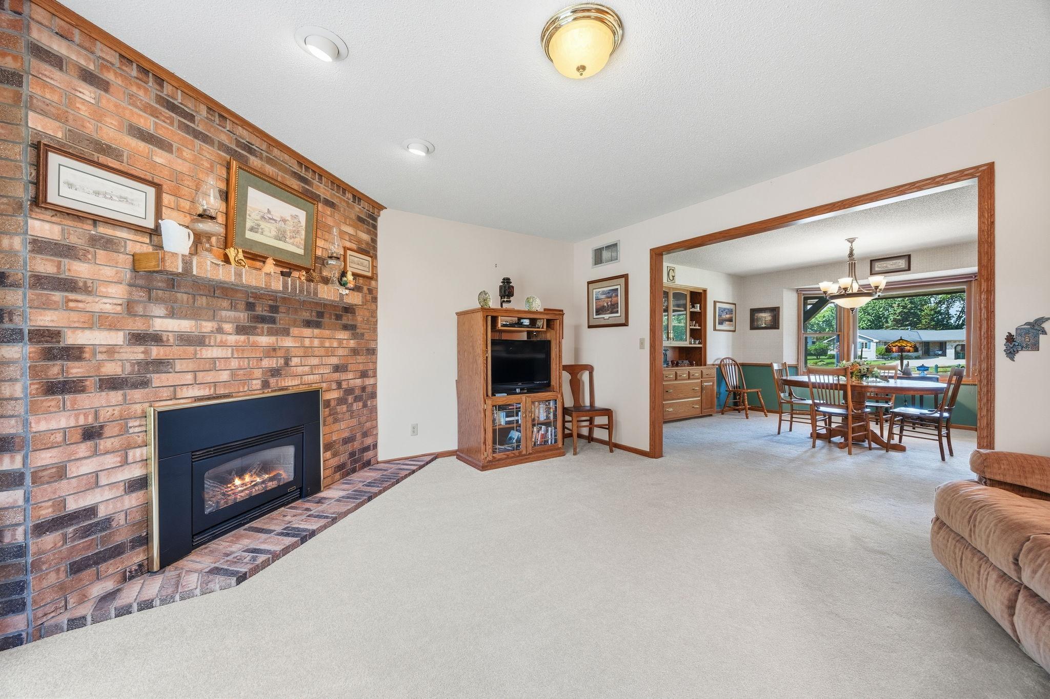 Beautiful brick surround gas fireplace