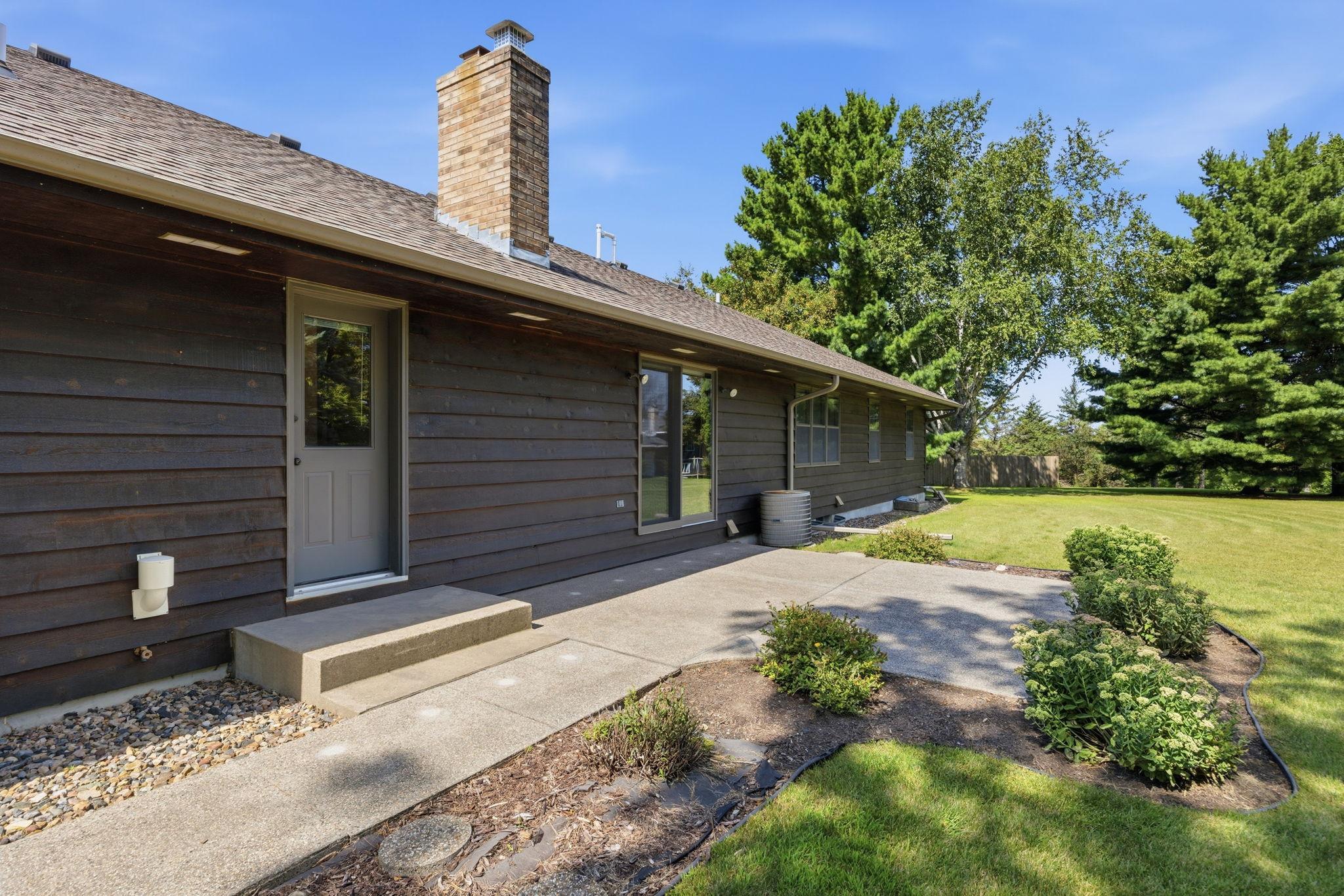 Back of home, entry to laundry room and family room