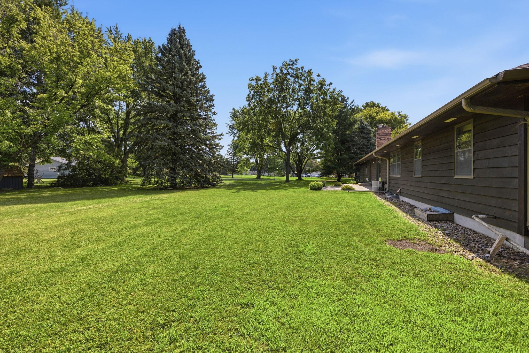 Backyard features mature tress and privacy
