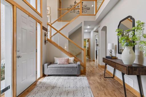 Spacious foyer with beautifully finished hardwood floor