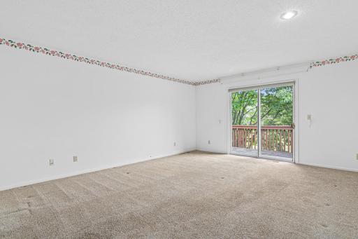 Primary bedroom on main floor with private deck