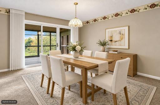 Virtually staged dining area leading to screen porch and fantastic back yard pond views