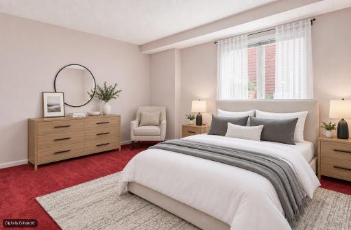 Virtually staged lower level bedroom 2 with double closets and large windows