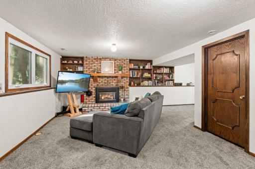 Lower level family room with gas fireplace for cozy winters