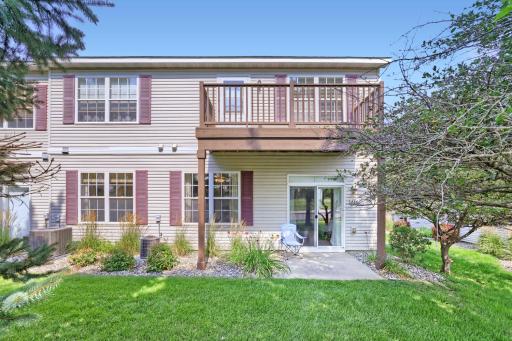 Charming patio out back has views of green space, and the benefit of the neighbors deck if it's ever snowing or drizzling!