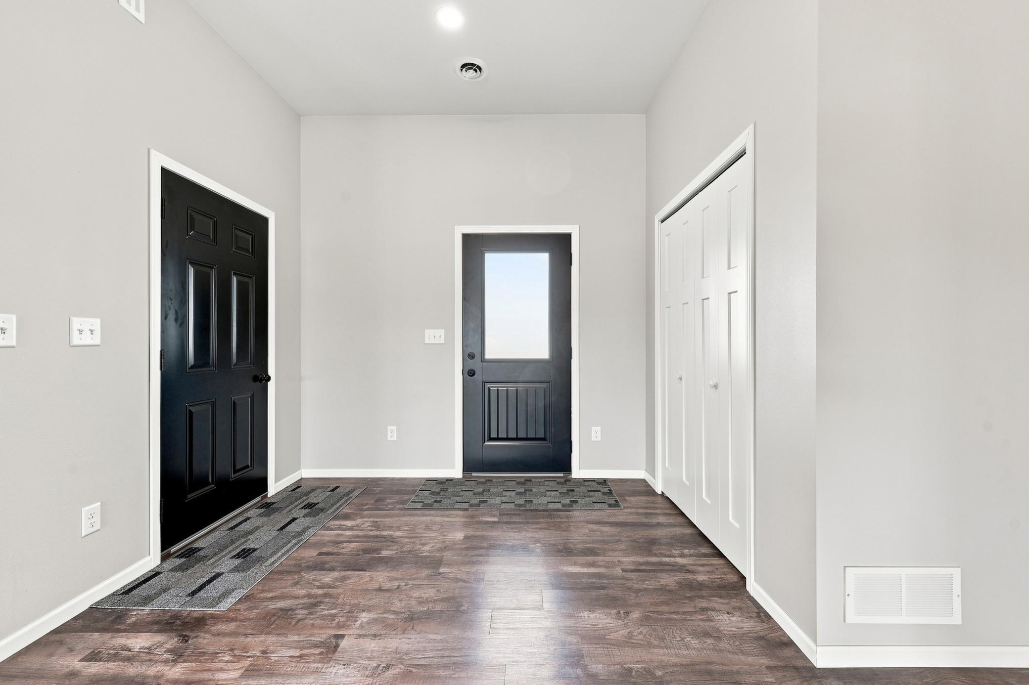 Large Front Foyer with large closet and direct access to oversized 3-stall garage