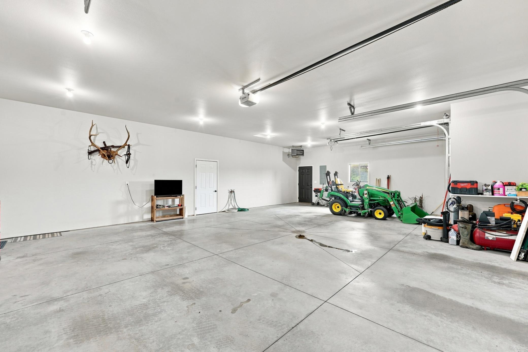 Oversized 3-stall garage; heated with floor drain and 3-phase 220 for welder, etc.