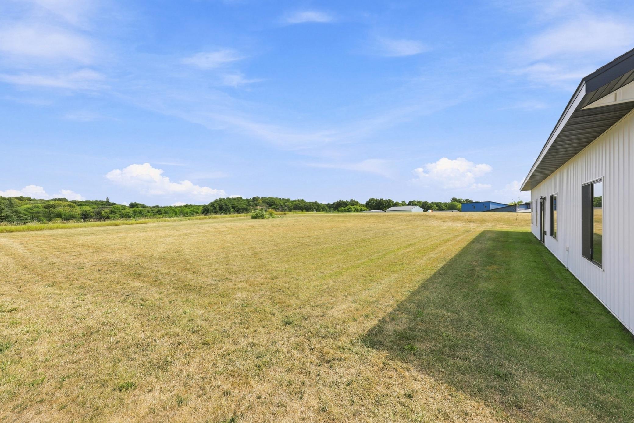 Backyard with no backyard neighbors and lots of space to add an additional outbuilding!