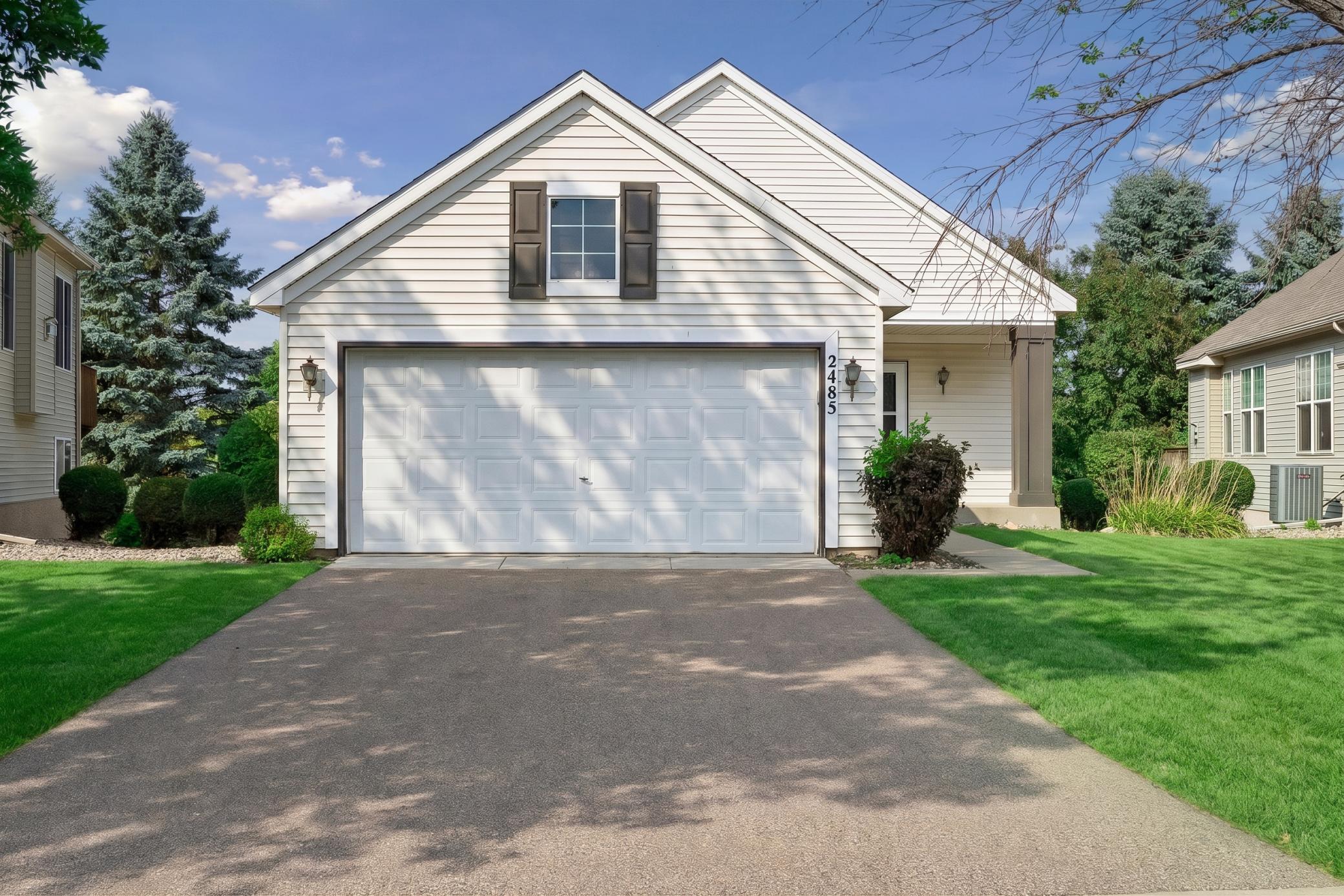 Photo for 2485 Prairie Oak Trail, Woodbury, MN 55125 - Listing #7127016 Welcome to one-level living in Woodbury Crossing featuring an attached 2-stall garage (20' x 22') with an asphalt driveway and a newer roof (2024).
