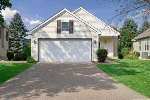 Welcome to one-level living in Woodbury Crossing featuring an attached 2-stall garage (20' x 22') with an asphalt driveway and a newer roof (2024).