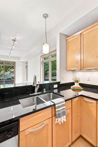 Kitchen looks out to living and dining areas