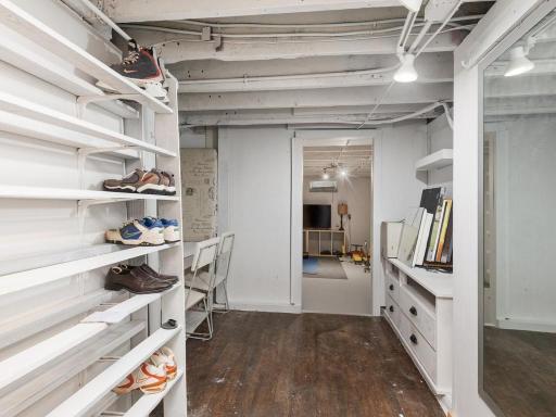 Lower level hallway to the flex room and upper unit laundry area.