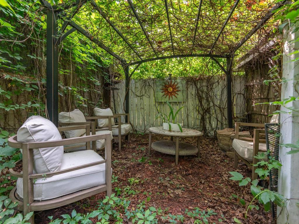 Wonderfully shaded patio area is perfect for small outdoor gatherings.