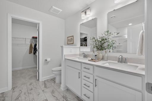 Primary en suite with dual vanity and walk-in closet