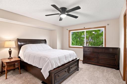Large primary suite with walk-in closet and 3/4 attached bath. (Virtually staged)