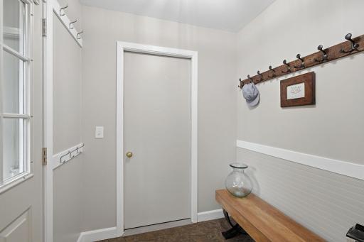 This door leads right into the attached garage, with a bench to sit & pull on your boots before heading out.