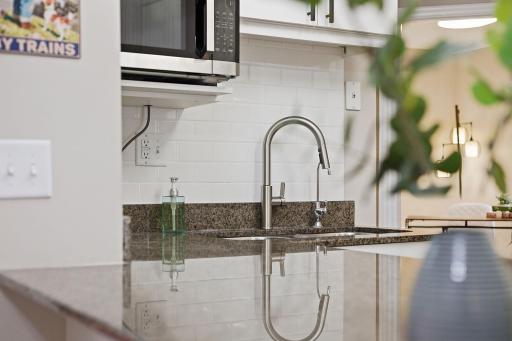 Fresh subway tile & a brand-new faucet make even dish duty feel like an upgrade!