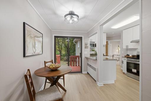 The dining area opens directly to the deck, making it easy to take meals outdoors.