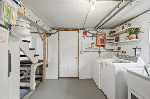 The walkout door is right by the laundry, so muddy boots, patio cushions & fresh-picked tomatoes go straight in & out.