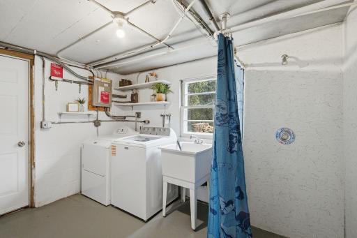 A second bath on the lower level, with a toilet room, shower & sink, is handy for rinsing off after yard work or a muddy day in the garden.