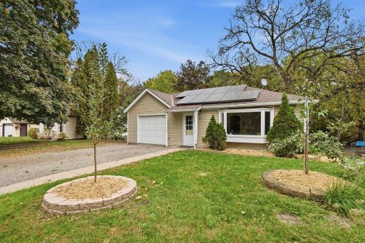Apple tree & established landscaping add character to the front yard.
