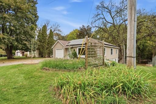 Garden beds & a trellis along the side yardâready for your green thumb!