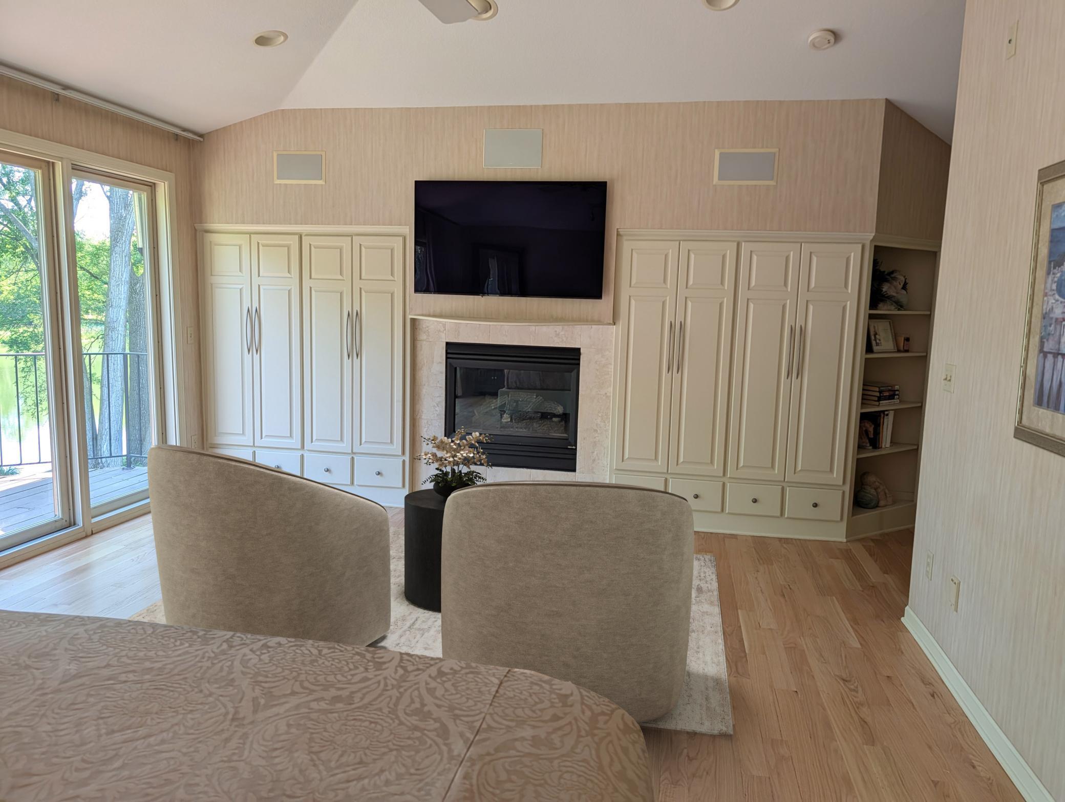 virtual staging to primary bedrooms gas fireplace and built-in storage