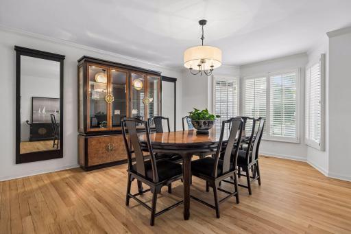 dining room with plantation- shuttered bay window