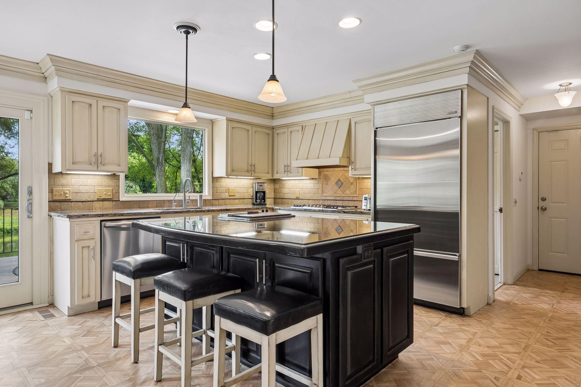 large granite center island, top of the line appliances