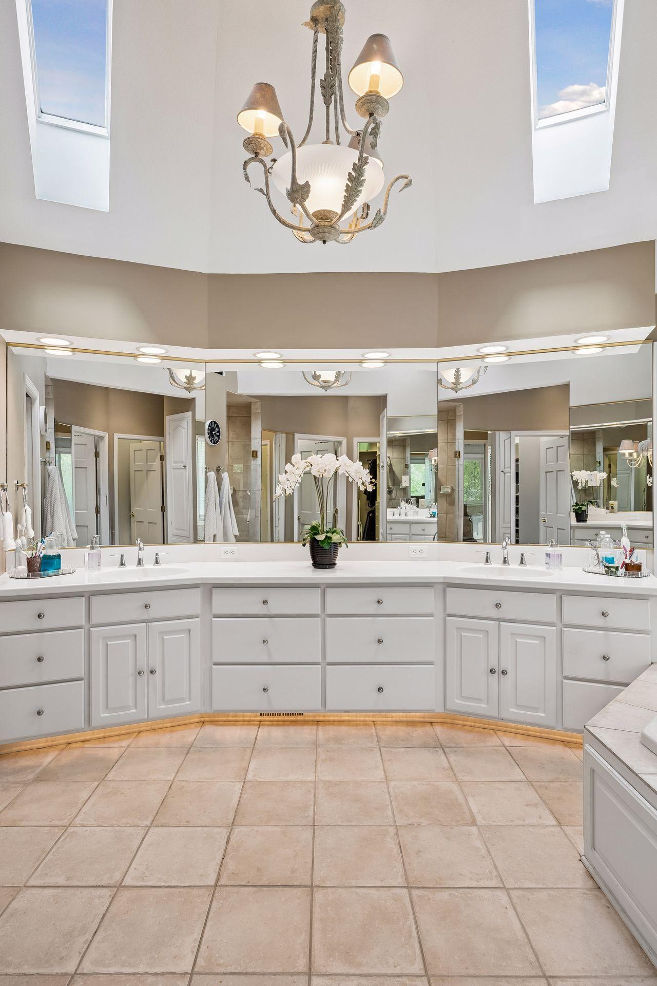 primary bath, vaulted ceiling and heated floor
