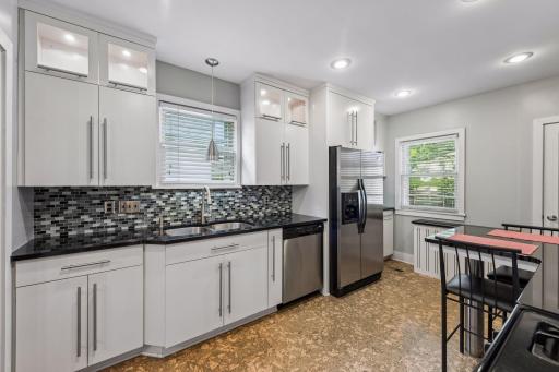 Another view of kitchen with nice coffee/wine bar on other side of refrigerator.