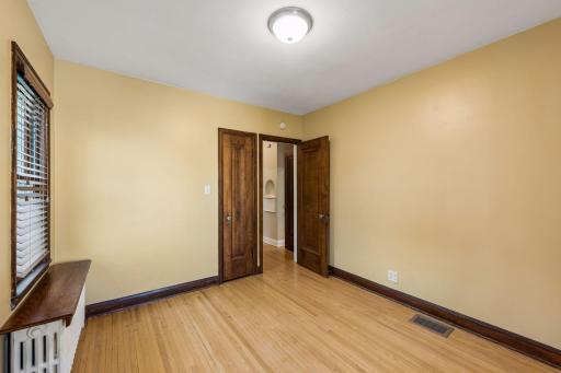 Another view of rear bedroom out to hallway and main floor bathroom.