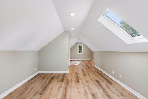 As you enter the upper-level Primary Suite all new luxury vinyl flooring, can lighting, 1 yr old skylight with remote shade, newer thermal pane windows.