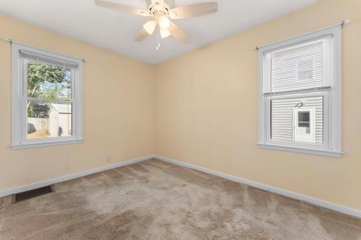 Original hardwood floors are beneath the carpeting