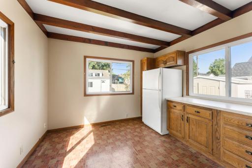 Kitchen overlooks the backyard and patio.