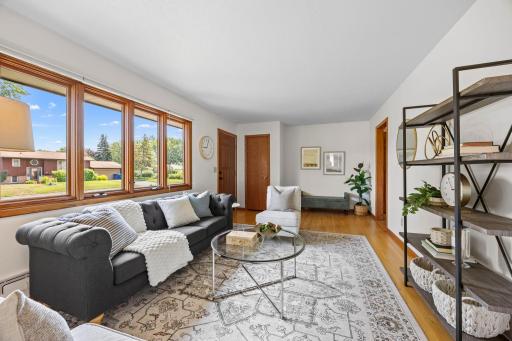 The main level has a great flow, with beautiful hardwood floors running throughout and large windows that fill the home with natural light.