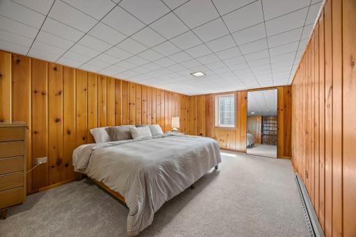 The lower level bedroom offers a comfortable and versatile space that feels like its own little retreat.