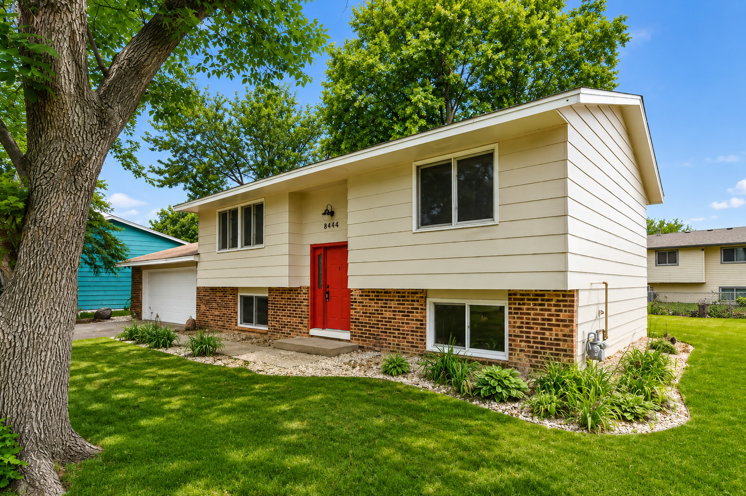 Freshly painted front door & brand new garage door!