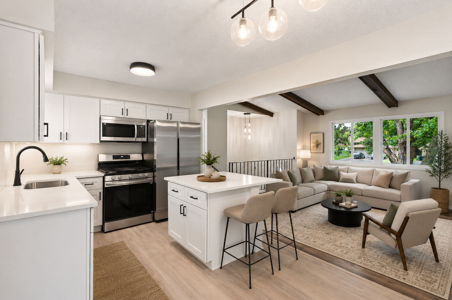 Virtually staged photo of the kitchen/living room areas