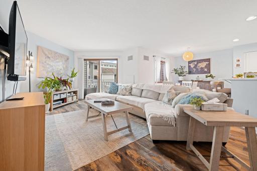 Bright open living area offering plenty of space for entertaining with the dining room and kitchen just beyond.