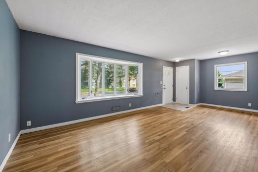 Front entryway with spacious main floor living room.