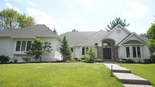 10725 Purdey Road is a sprawling, one story, destination home that exudes curb appeal with a grand entry, brand new roof, fresh exterior paint, mature landscaping with accent lighting and a sprinkler system, and a side-load garage off the cul-de-sac.